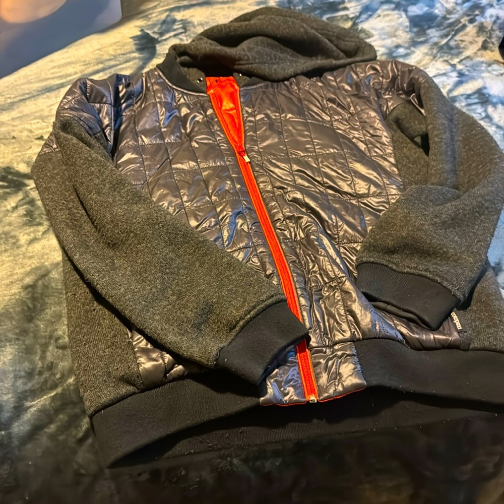 Cotopaxi black with orange lining multi texture jacket
